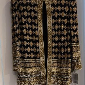 Is a brand new party blazer black with gold